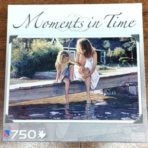 New Unopened 750 piece puzzle moments in time